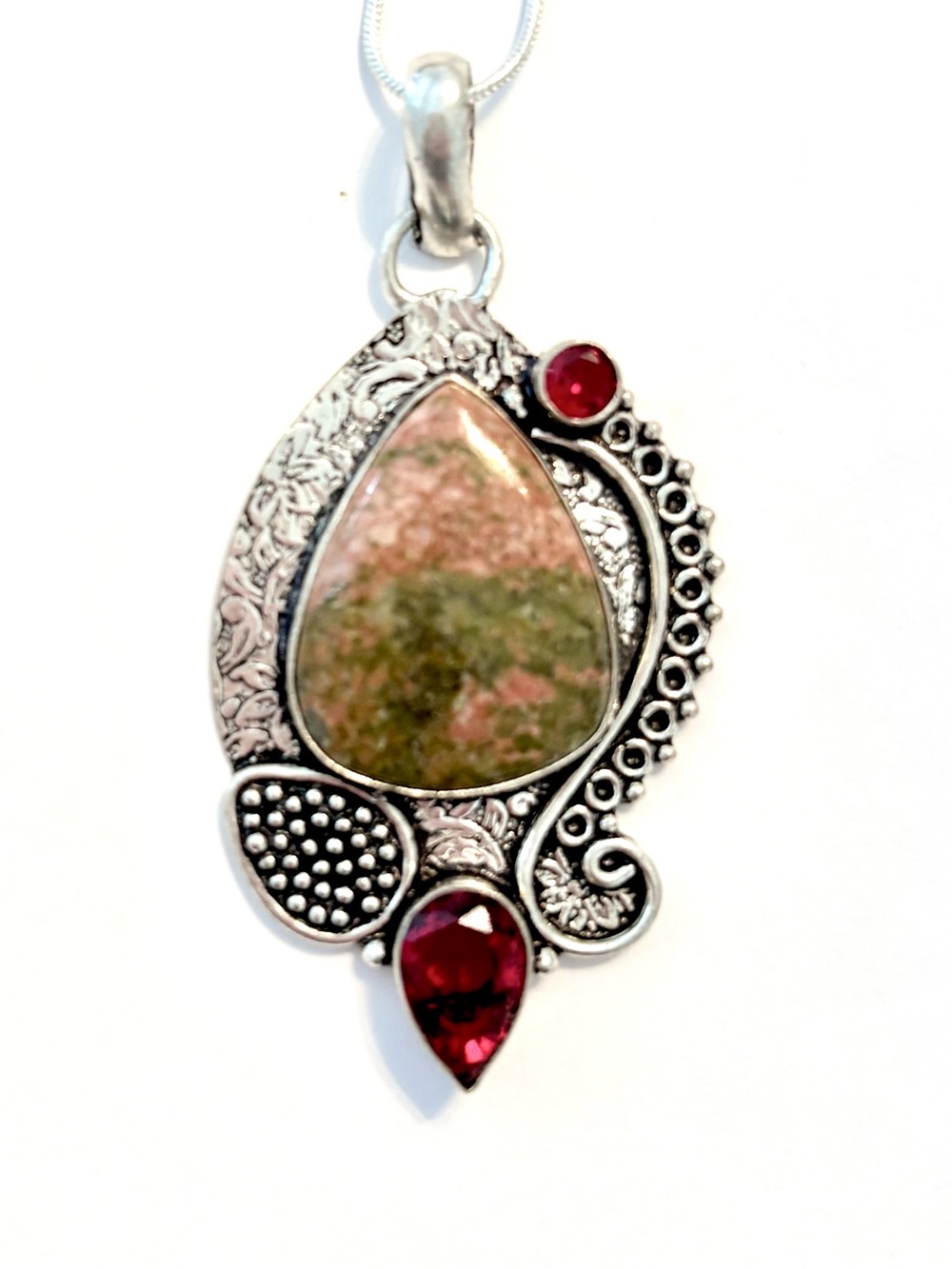 Beautiful, 2 inch, 925 marked, Unakite and Garnet pendant on a silver chain.